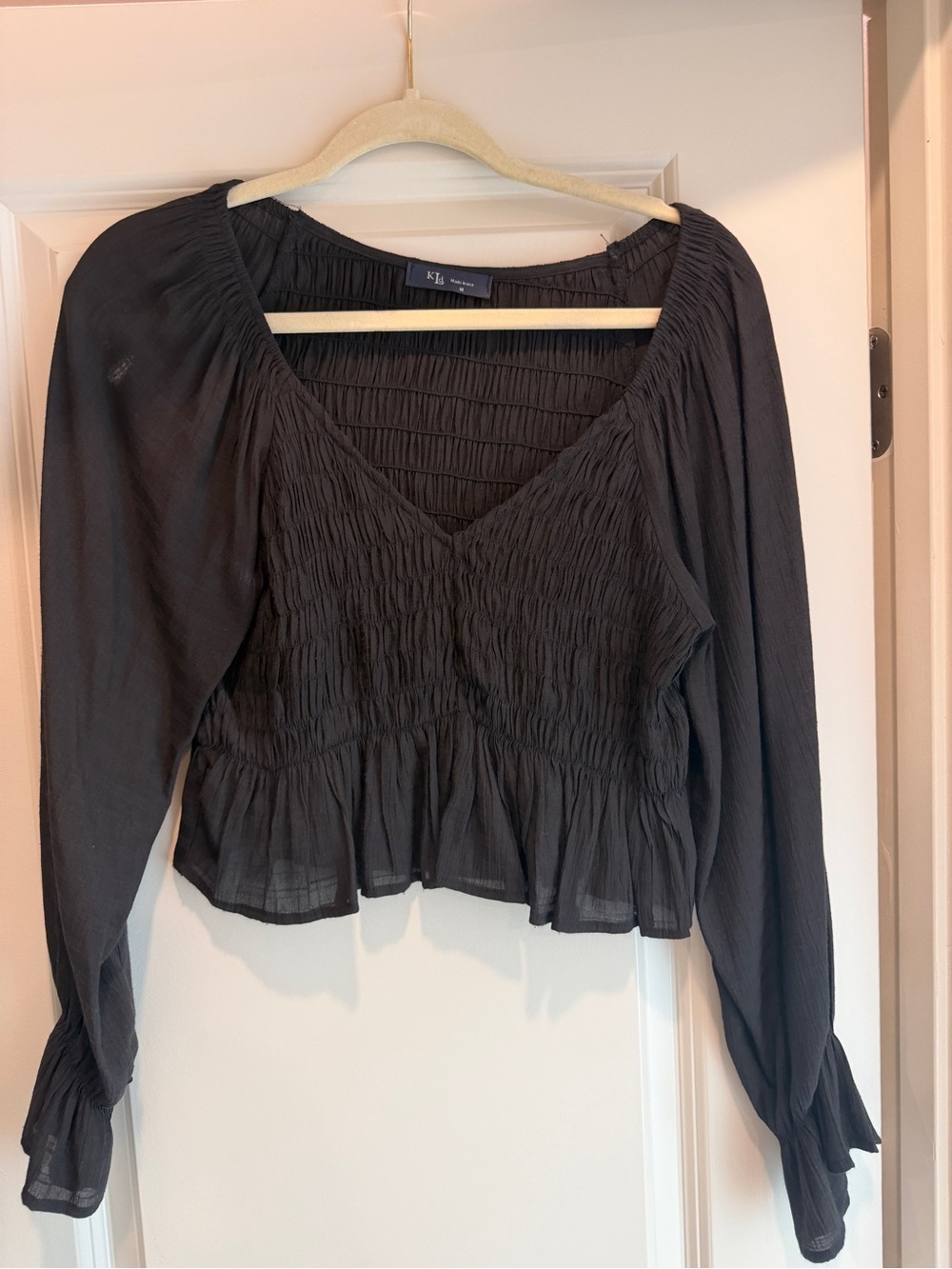 Black Smocked V-Neck Peplum Blouse